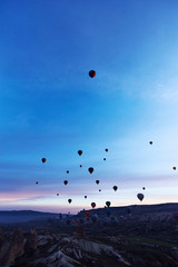Mountain landscape with large balloons in a short summer season at dawn.