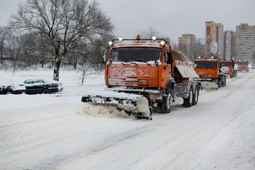 snowplough, snowplows, snow removal on the streets, KAMAZ removes snow, cleaning roads during snowfall, clearing the road of snow