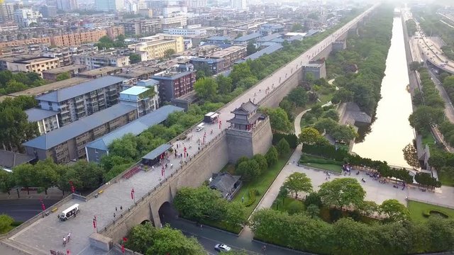 Aerial view over Xi'an City Wall. People ride with bicycles at City Wall. Xian, China.