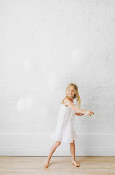 Girl Playing With Balloons