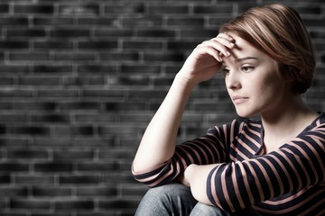 Young woman crying on background