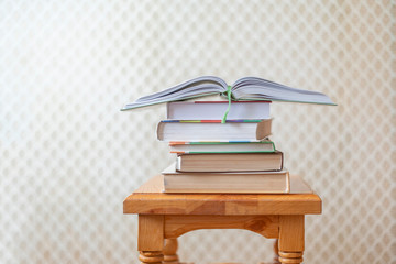stack of books on wooden surface  f