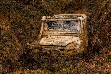  4x4 truck stuck in a gully using an electric winch to free itself © David Maddock