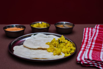 South Indian breakfast Dosa with sambar, chutney and aloo baji
