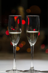 glasses of champagne, in the background points of color