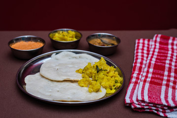South Indian breakfast Dosa with sambar, chutney and aloo baji