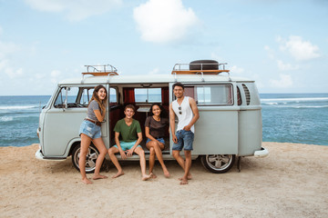 Group of young cheerful and smiling while leaning at retro style