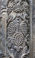 Vegetable ornament in a strip of metal decorating the entrance to the church_