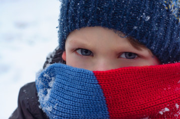 Scarf cover kids face in cold winter. Blue eyes boys portrait. Winter scene