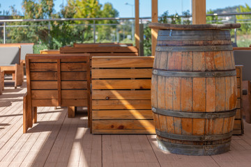 View of outdoor bar terrace, rustic wood, wooden barrels
