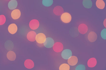 Blurred defocused multicolored bright light, shiny spots, colorful lilac background