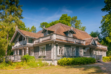 Fototapeta na wymiar Historic manor house situated in Palace Park dating from 1845, the oldest building in Bialowieza town, Poland.