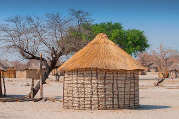 Typical thatched roof African round hut in Botswana.