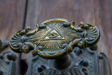 All seeing eye of illuminati on a door knob of the Illuminati freemason in Stockholm, Sweden.