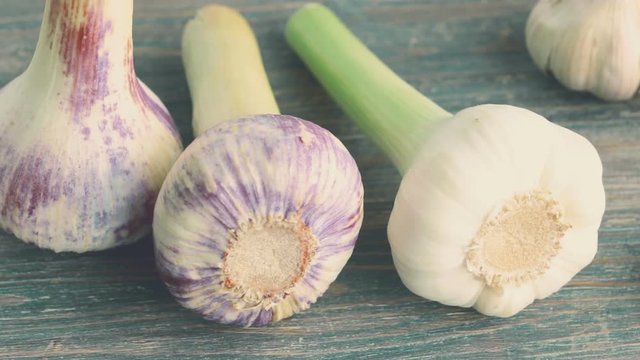 Fresh garlic bulbs on wooden table. Closeup. 