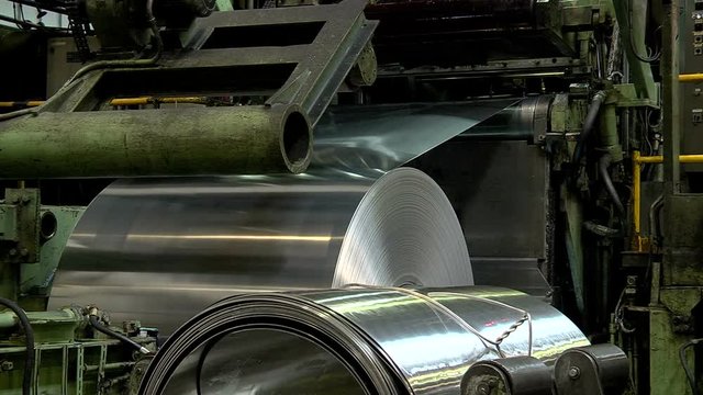 Large roll of stainless steel in the factory floor