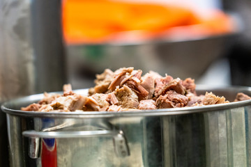 Freshly Boiled Pork in Stainless Steel Kettle on Table - Meal Preparation for Wedding