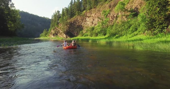 Epic Rafting Two Orange Boat on Shallow Mountain Forest Zilim River in Ural Mountains, Russia at summer sunny day - Aerial view