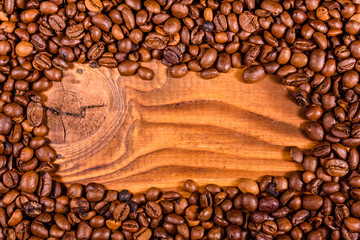 Frame of coffee beans on wooden table
