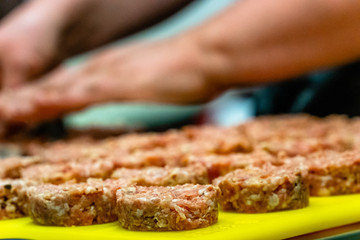Female Chef Making Round Pork Cutlet for Some Burgers for  Wedding Meal