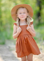 portrait of little girl outdoors in summer