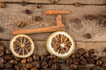 A bicycle made from pieces of dried lemons and cinnamon sticks, a path made from coffee beans...