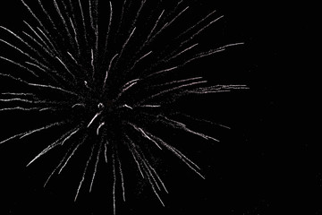 Obraz premium Fireworks in the night sky. Texture salute. Abstract photo of flares on a black background. Photos of lights salute in the sky. Image of salute flashes. Texture of colored lights.