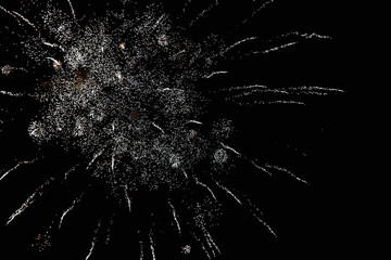 Fireworks in the night sky. Texture salute. Abstract photo of flares on a black background. Photos of lights salute in the sky. Image of salute flashes. Texture of colored lights.