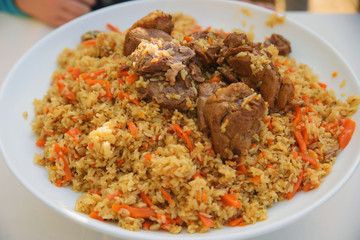 pilaf and other dishes in the cauldron. Methods and ingredients for cooking pilaf. Lamb and beef in Eastern cuisine