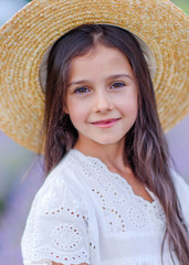 portrait of little girl outdoors in summer