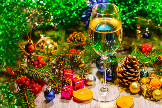 a glass of champagne or white wine on a new year background, Christmas decorations
