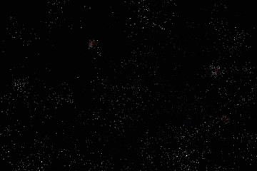 Fireworks in the night sky. Texture salute. Abstract photo of flares on a black background. Photos of lights salute in the sky. Image of salute flashes. Texture of colored lights.