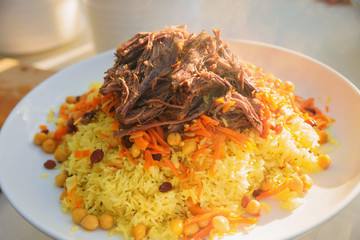 pilaf and other dishes in the cauldron. Methods and ingredients for cooking pilaf. Lamb and beef in Eastern cuisine