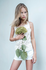 portrait of little girl outdoors in summer