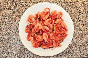 Shrimp. Shrimps lie on a plate. Boiled ready-to-eat shrimp. A large dish of small shrimps.