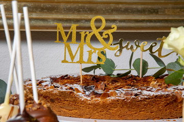 Fresh baked Cake with almondes and stick Mr and Mrs wedding cake