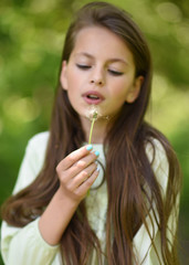 portrait of  young girl outdoors in summer