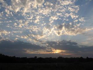 Fototapeta premium The natural landscape and the evening sky. Summer. Ukrainian rural landscape.