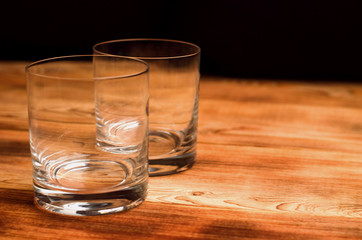 Glasses for whiskey on a wooden table