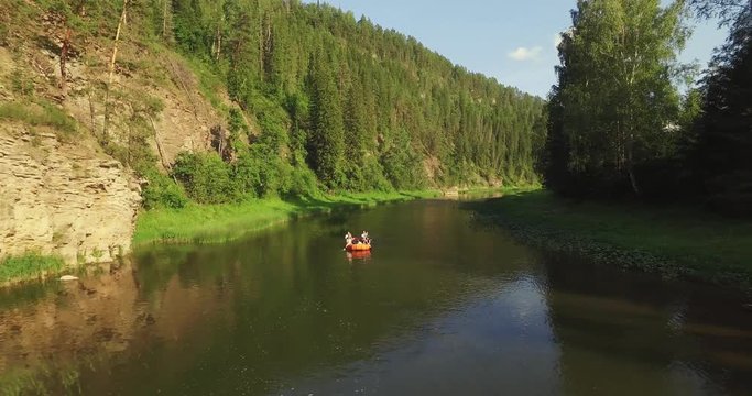 Epic Rafting Two Orange Boat on Shallow Mountain Forest Zilim River in Ural Mountains, Russia at summer sunny day - Aerial view