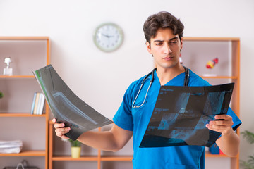 Young handsome doctor radiologyst working in clinic 