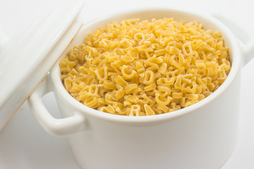 Letter-shaped pasta in a mini pan