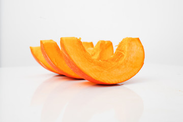 Sliced pumpkin on a white background