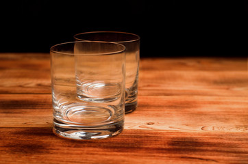 Glasses for whiskey on a wooden table