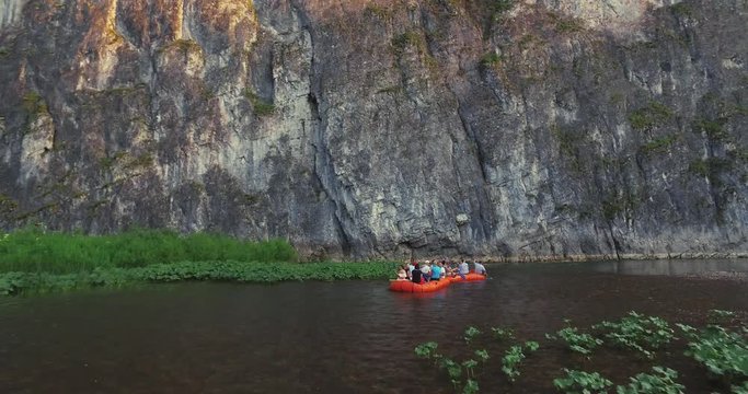 Epic Rafting Two Orange Boat on Shallow Mountain Forest Zilim River in Ural Mountains, Russia at summer sunny day - Aerial view