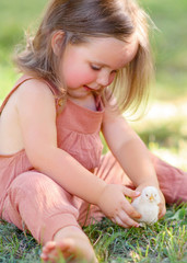 portrait of little girl outdoors in summer