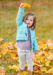 portrait of a little girl in autumn