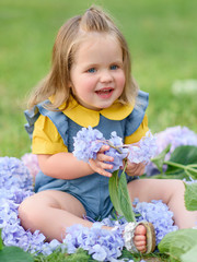 portrait of little girl outdoors in summer