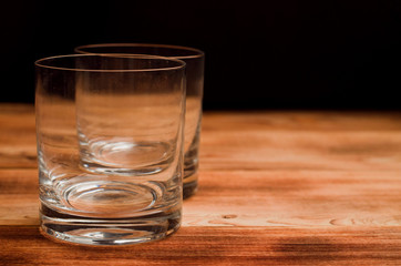 Glasses for whiskey on a wooden table