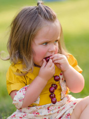 portrait of little girl outdoors in summer